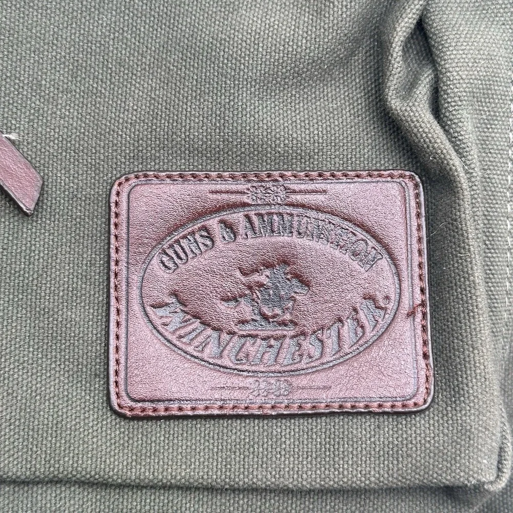 VINTAGE WINCHESTER GUNS AND AMMUNITION GREEN CANVAS AND LEATHER MESSENGER BAG